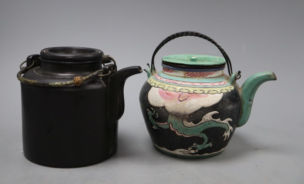 A Chinese enamelled Yixing teapot, height 13cm and a black Yixing teapot